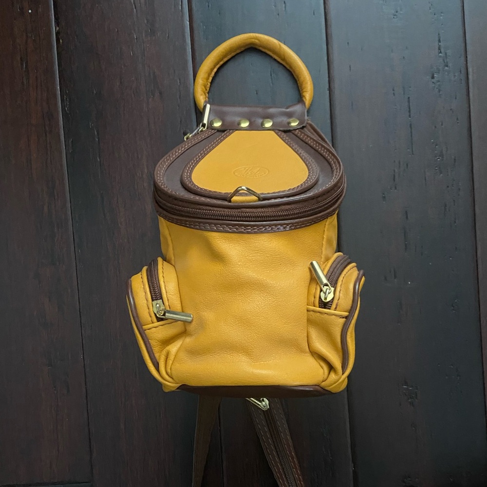 VA made in Italy, yellow orange leather backpack.